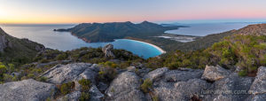 wineglass bay and the freycinet peninsula from mt amos at sunrise