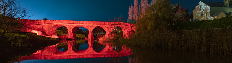 Richmond Bridge lit up in red for Dark Mofo